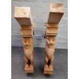 A pair of oak corner brackets relief carved with grotesque figures, 90cm wide x 94cm high, (2).