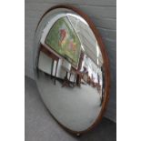 A large modern convex circular wall mirror, with metal band frame, 118cm diameter.