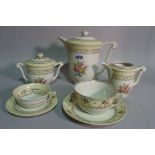A Limoges floral decorated tea set, comprising 12 cups and saucers, coffee pot and sugar bowl,