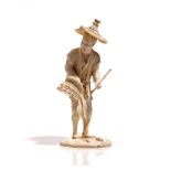 A Japanese ivory okimono of a fisherman, Meiji / Taisho period,