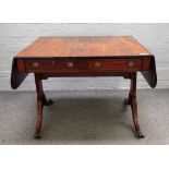 A George III mahogany sofa table, with opposing opposite frieze drawers, on four downswept supports,