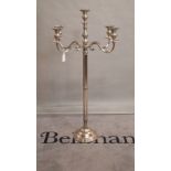 A modern chrome plated floor standing five branch candelabra, 147cm high.