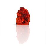 A Chinese amber carving of a man, Qing dynasty, carved standing with a staff,