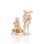 A Japanese sectional ivory okimono of two farmers, Meiji period, one standing carrying an adze,