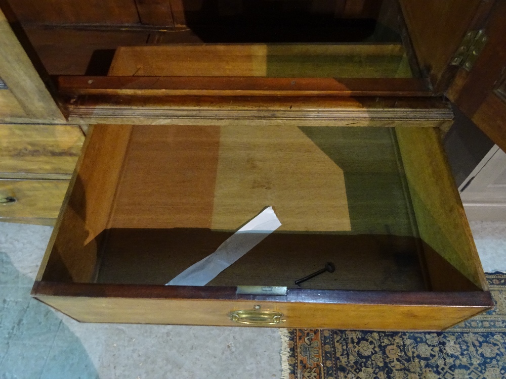 A George III mahogany linen press with moulded cupboard doors over two short and one long drawer, - Image 3 of 9