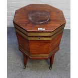 A George III brass bound mahogany octagonal wine cooler on tapering square supports,