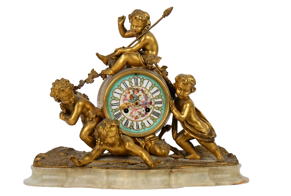 A French gilt-bronze and onyx mantel clock, 19th century,