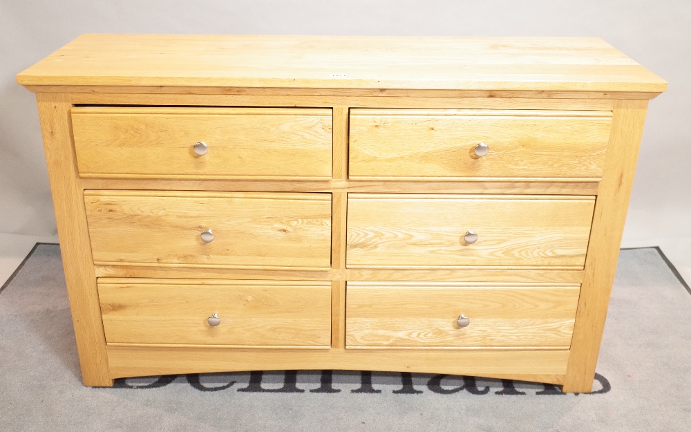 A modern oak side chest of six short drawers, 126cm wide x 78cm high.