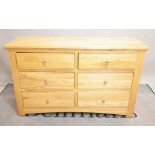 A modern oak side chest of six short drawers, 126cm wide x 78cm high.