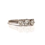 A white gold and diamond three stone ring,