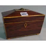 An early 20th century rosewood inlaid tea caddy of sarcophagus form,