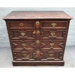 A Charles II oak chest of four long geometric moulded drawers, 104cm wide x 98cm high.