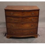 A late George III mahogany bowfront chest of four long graduated drawers on bracket feet,