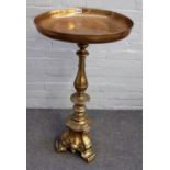 A 19th century lacquered brass alter candlestick, with a later dish top, 94cm high.