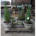 A pair of modern reconstituted stone planters with swag relief decoration,