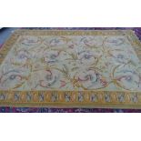 A modern Savonnerie-style carpet, the pale sage field with scrolling acanthus leaves,