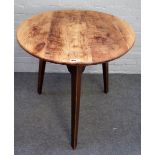 A George III fruitwood cricket table, the circular top on three canted square supports,