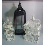A group of three modern hanging bird cages, the largest 70cm x 21cm and a candle lantern, (4).