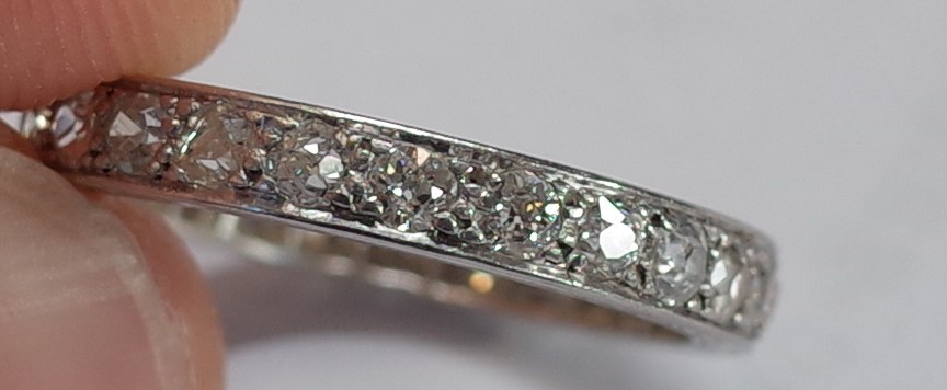 A platinum and diamond set full eternity ring, mounted with cushion shaped diamonds, - Image 3 of 6