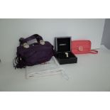 A Versace VJC purple leather twin handled handbag, with silver-tone hardware and applied tassels,
