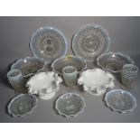 A modern glass part dinner service including plates,