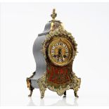 A late 19th century Boulle work mantel timepiece, the movement detailed MEDAILLE D'ARGENT 1889,