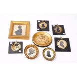 A group of 19th century portrait miniature silhouettes and a drawing of two young ladies,