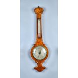 A Victorian walnut wheel barometer with 8in silvered dial signed 'W. H. YOUNG BOSTON' 95cm high.