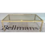 A modern brass and glass rectangular coffee table, 114cm wide x 38cm high.