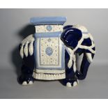 A modern Asian ceramic garden seat formed as an elephant, 55cm wide.