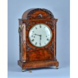 An early Victorian mahogany three train quarter striking bracket clock The arched case with canted