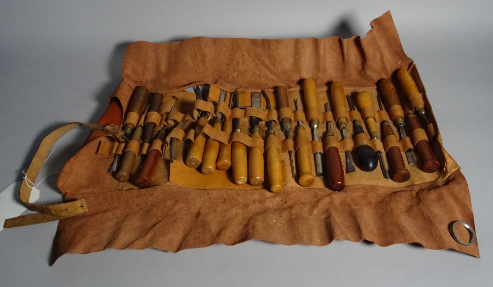 A quantity of early 20th century carpenters tools within a leather case.