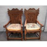 A pair of 17th century style carved oak Wainscot open armchairs on turned