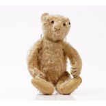 An early 20th century Steiff blonde mohair teddy bear,