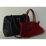 A Longchamp two handled navy leather bag,