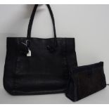A Gucci lady's black leather tote shoulder bag, model number 267903, with plaited leather straps,