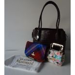 A Vivienne Westwood tartan clutch bag with detachable strap and maroon patent interior and trim;