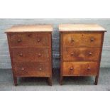 Possibly Heals; a pair of early 20th century limed oak three drawer chests, on block supports,