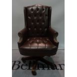 A modern hardwood framed wingback office armchair, 68cm wide x 120cm high.