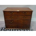 A 19th century mahogany chest of four long graduated drawers on a plinth base,