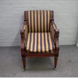 After Thomas Hope; a mahogany framed square back armchair on tapering turned supports,