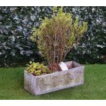 A rectangular lead planter, the sides with ribbon tied bell-flower swags,
