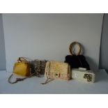 A collection of five designer leather hand bags, comprising: A Koret black leather evening bag,