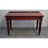 A George IV mahogany serving table, the rectangular top on tapering carved fluted supports,