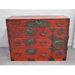 A pair of Japanese stained hardwood and metal mounted tansu's each with an arrangement of drawers