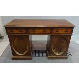 A Victorian mahogany pedestal desk with three frieze drawers over moulded panelled doors,