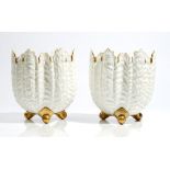 A pair of Coalport white and gilt bone china shell moulded jardinieres, late 19th century,