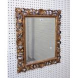 A Florentine gilt framed mirror with shell and acanthus chased frame and bevelled mirror plate,