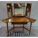 A mid-20th century teak dressing table with single drawer on tapering supports,