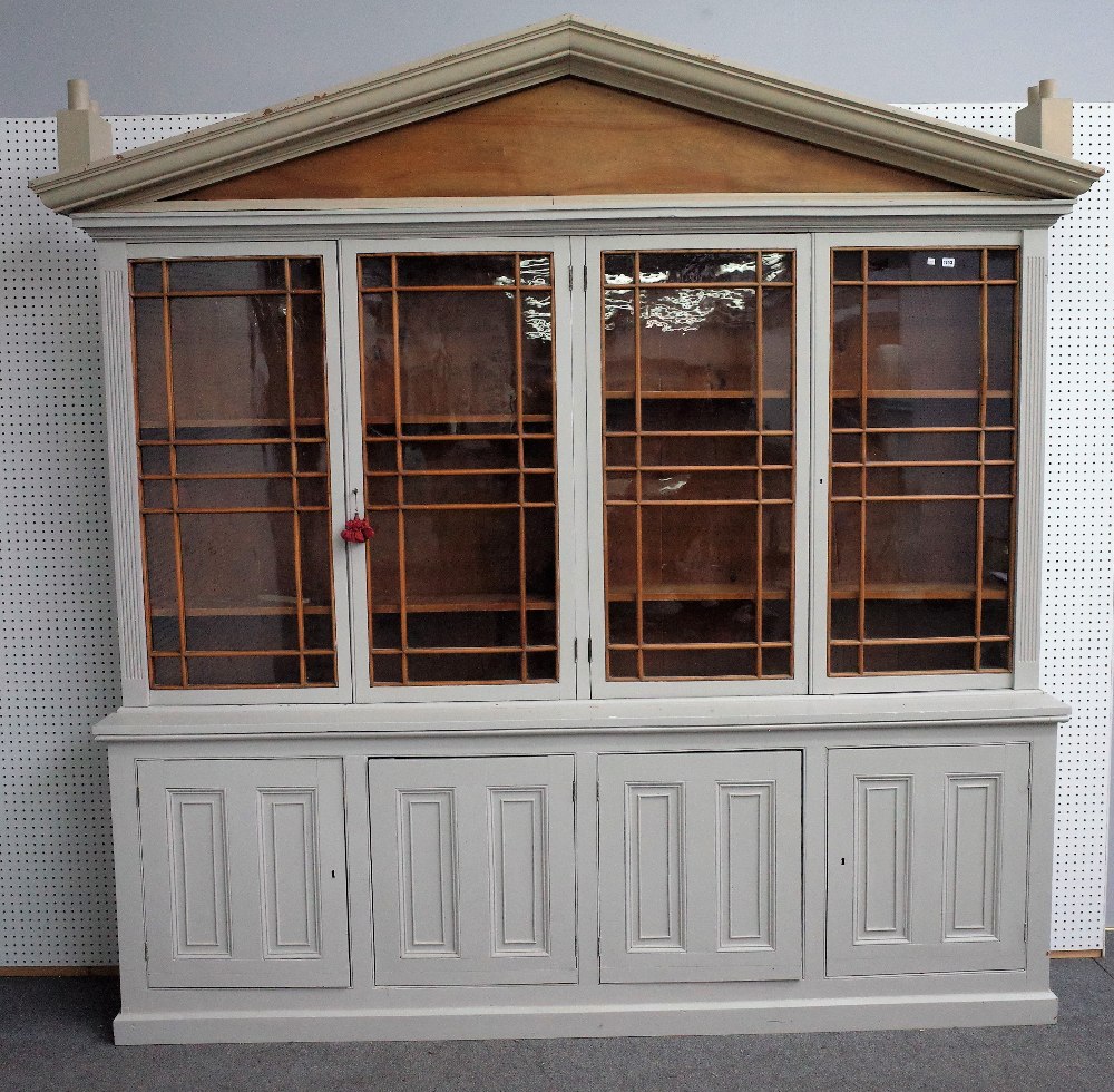 A grey painted bookcase cabinet,